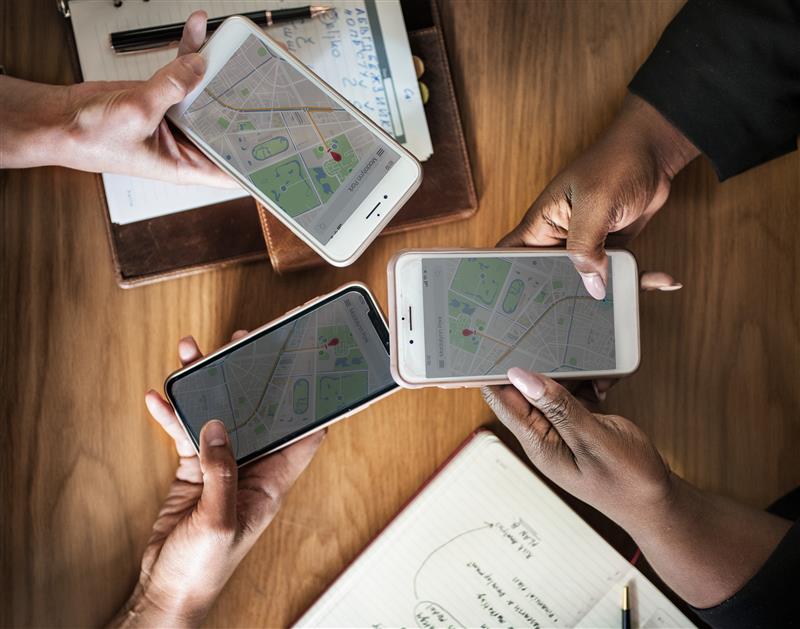 Developers working on scalable mobile app architecture for hyper-local discovery solutions by Ariel Software Solutions